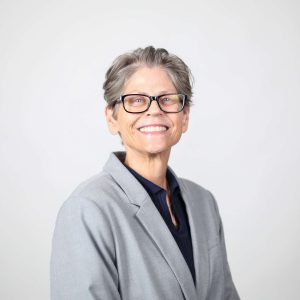 Kim Hass in grey suitcoat